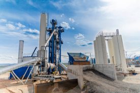 Wide shot of factory for asphalt production near capital city Sofia in Bulgaria. Manufacturing equipment. The photo is shot with Sony A7III camera.