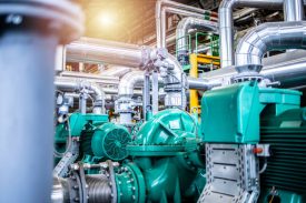 Interior view of an oil and gas petrochemical refinery plant with pipeline and valves. Industrial fuel production.